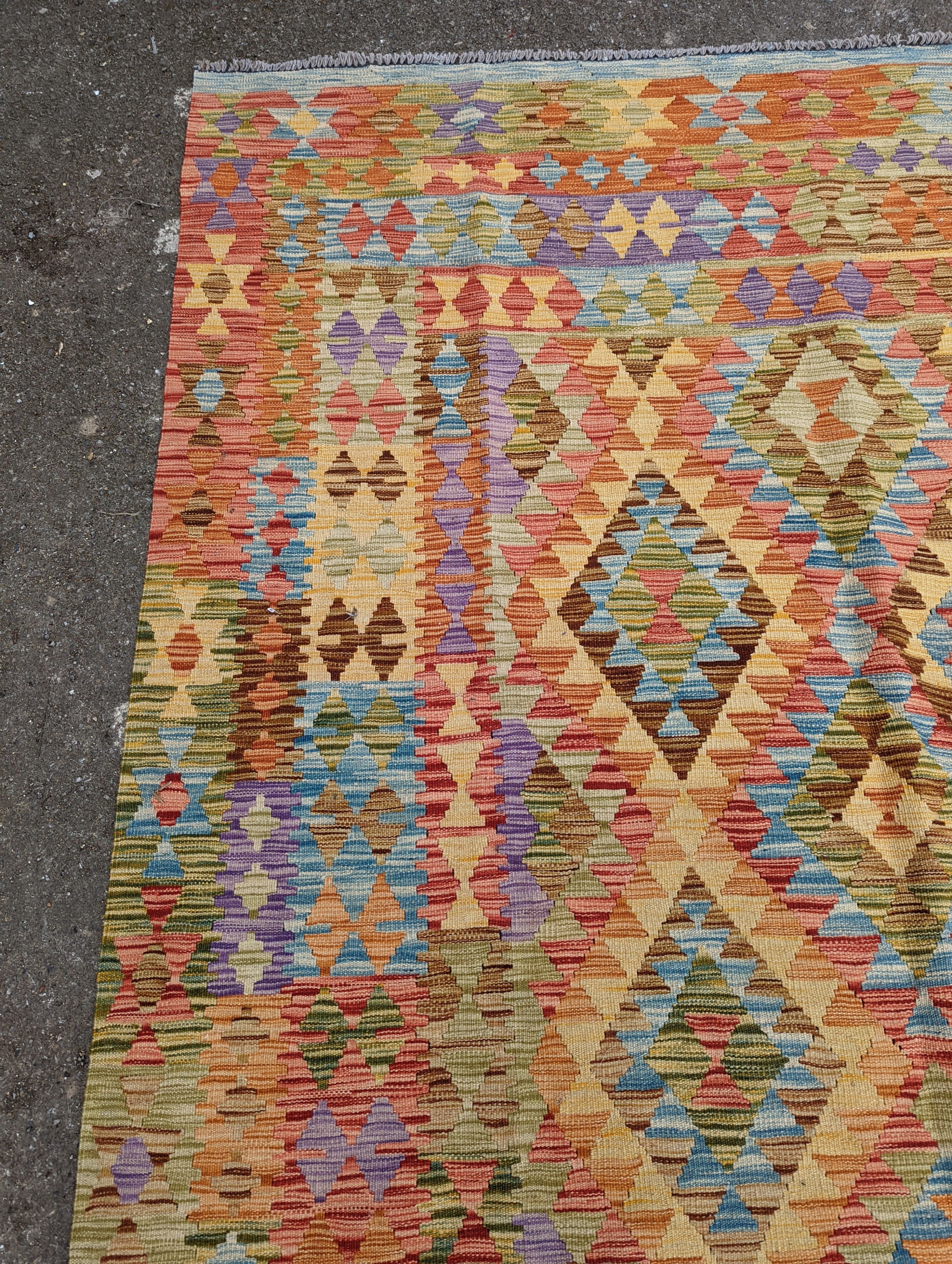 A contemporary Anatolian design Kilim flatweave carpet, approx. 300 x 200cm